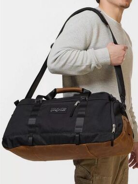Jansport Smooth Ride Duffel Black and Brown with Leather-Style Base. NEW!!
